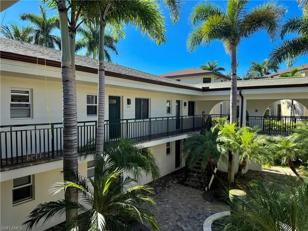 a view of a house with balcony and garden