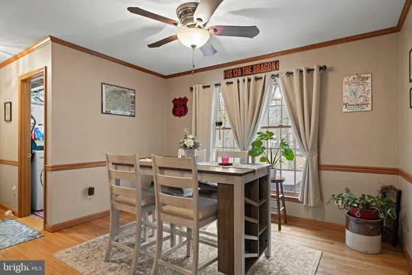 a kitchen with stainless steel appliances granite countertop a sink a stove and cabinets