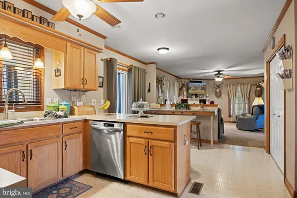 a view of a kitchen area with furniture and flat screen tv