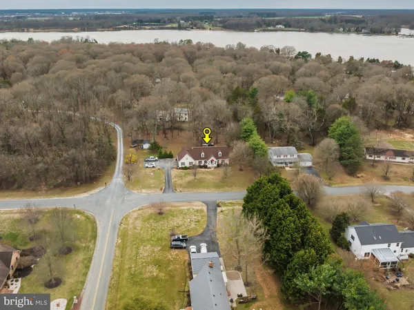 an aerial view of a house with lake view