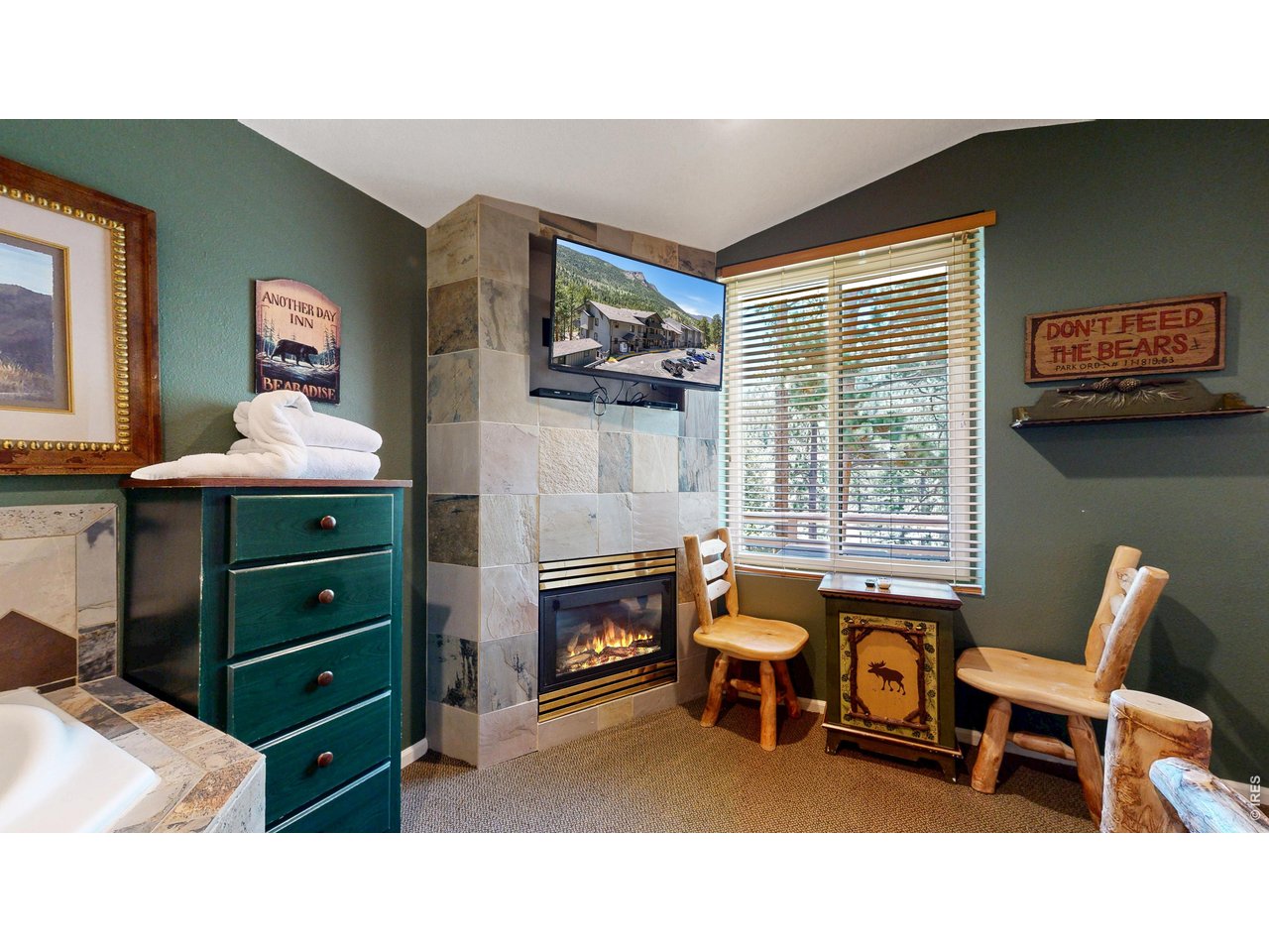 2760 Fall River Road, Unit 106 Estes Park, CO 80517 - Photo 5 of 26 Fire place for a relaxing time