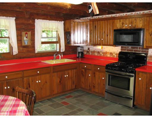 245 Chesterfield Road Westhampton, MA 01027 - Photo 5 of 14 a kitchen with stainless steel appliances a stove a sink and a microwave