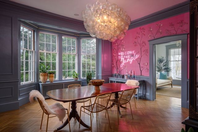 a dining room with furniture and window