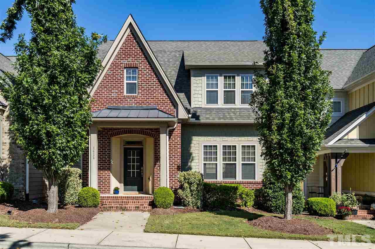 1411 Van Page Boulevard Raleigh, NC 27607 - Photo 1 of 26 a front view of a house with garden