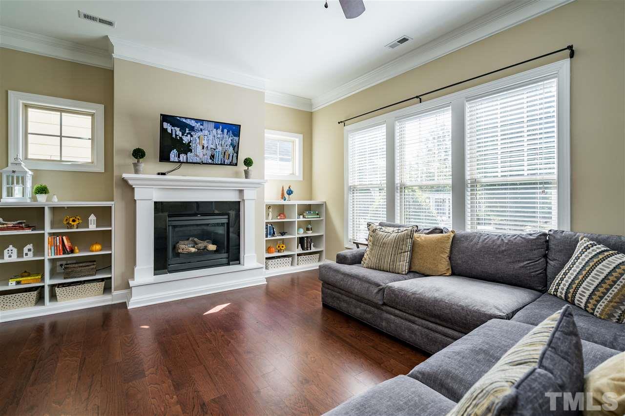 1411 Van Page Boulevard Raleigh, NC 27607 - Photo 6 of 26 a living room with furniture and a fireplace
