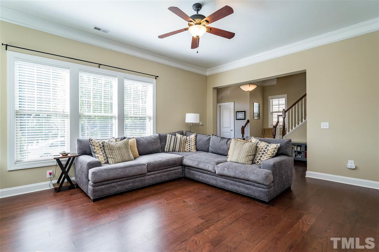 1411 Van Page Boulevard Raleigh, NC 27607 - Photo 7 of 26 a living room with furniture and a large window