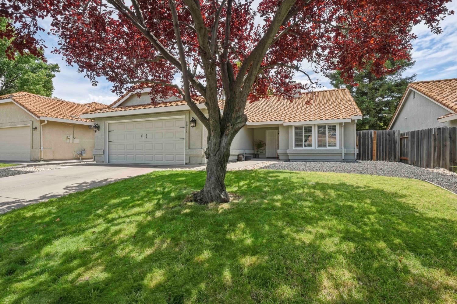 5013 Charter Road Rocklin, CA 95765 - Photo 35 of 35 a house with green field in front of it