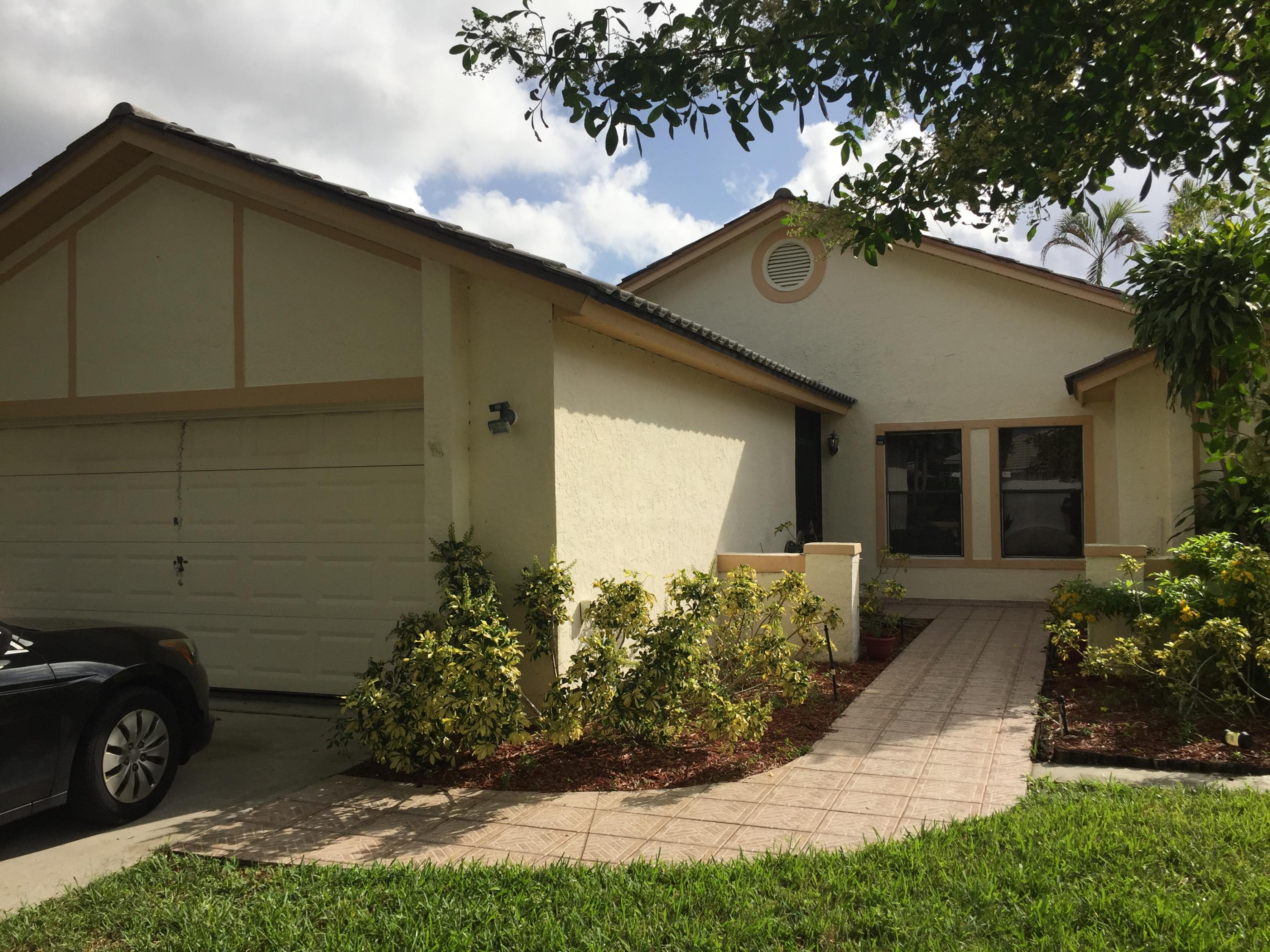 10383 Islander Drive Boca Raton, FL 33498 - Photo 1 of 10 Front Right