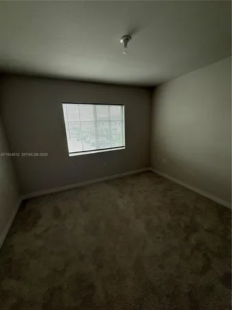 a view of a backyard of the house