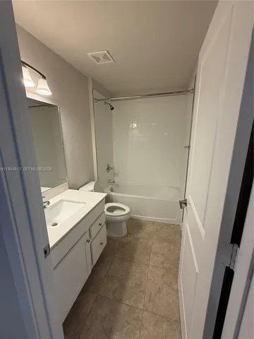 a view of a livingroom and a sink
