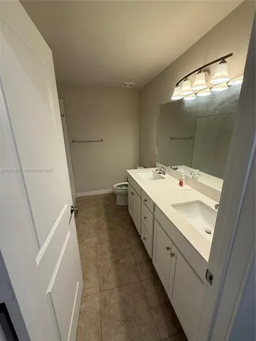 a childrens park with lots of swings and slides