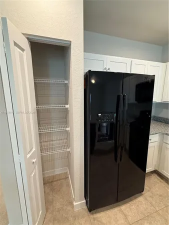a kitchen with a sink and a stove top oven