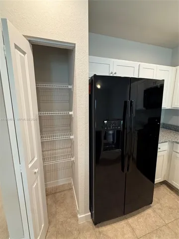 a kitchen with a sink and a stove top oven