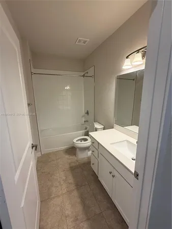 a view of an empty room with a balcony