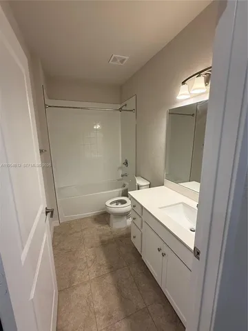 a view of an empty room with a balcony