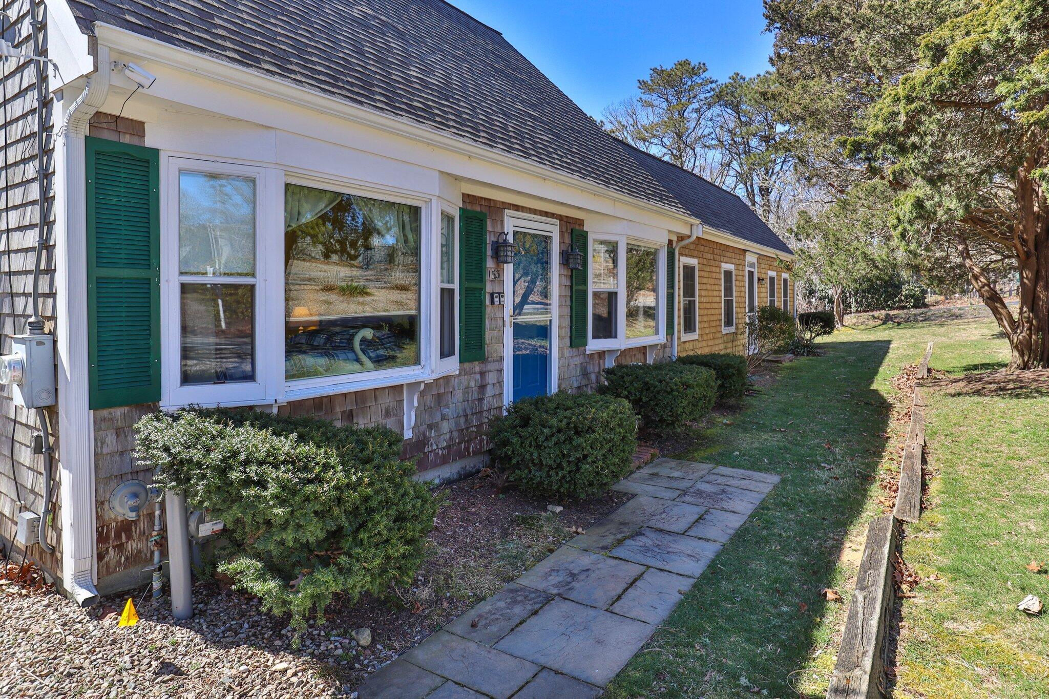 153 Long Road Harwich Port, MA 02646 - Photo 38 of 44 front view of a house with a yard