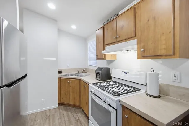 a kitchen with a stove and a sink