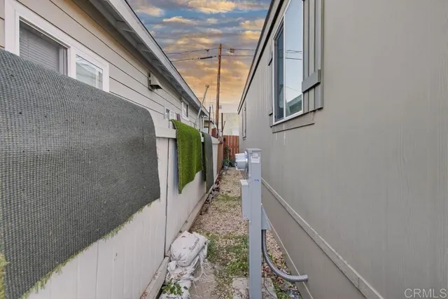 a view of a pathway of a building with wooden walls