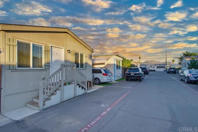 a view of a car park in front of house