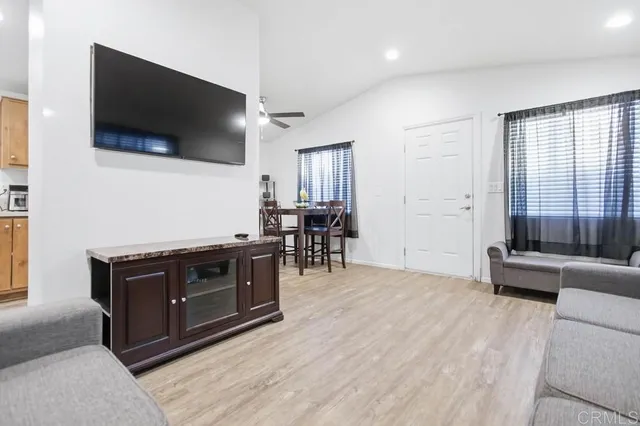 a view of kitchen with furniture and flat screen tv
