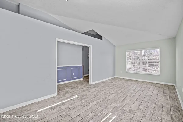 a view of an empty room and window