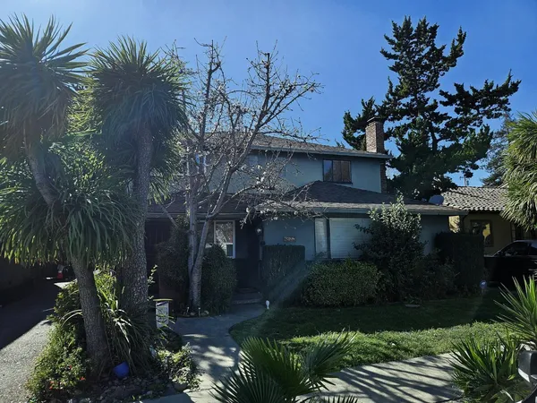 a backyard of a house with lots of green space
