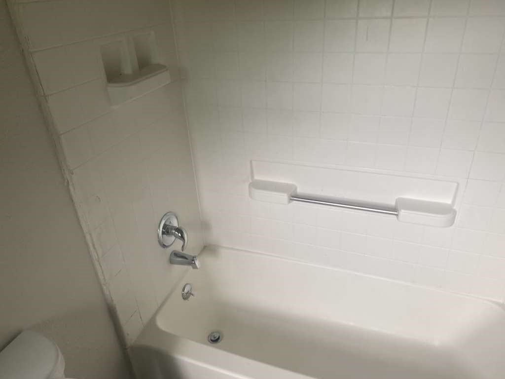 13626 Collins Street Kendleton, TX 77417 - Photo 11 of 16 a bathroom with a bathtub