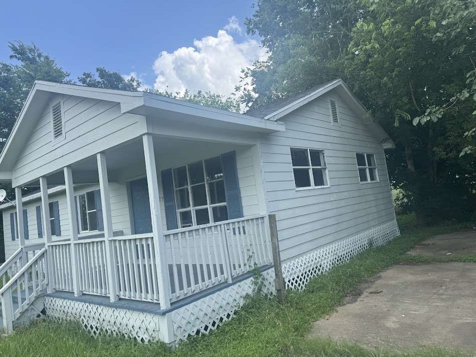 13626 Collins Street Kendleton, TX 77417 - Photo 3 of 16 a view of a house with a yard