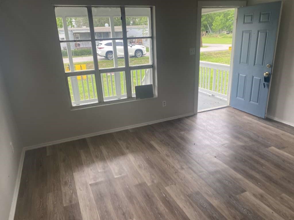 13626 Collins Street Kendleton, TX 77417 - Photo 4 of 16 a view of an empty room and window