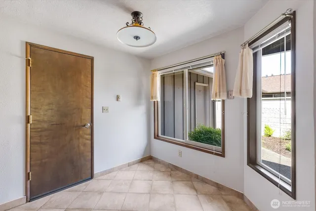 a kitchen with cabinets a sink and stainless steel appliances