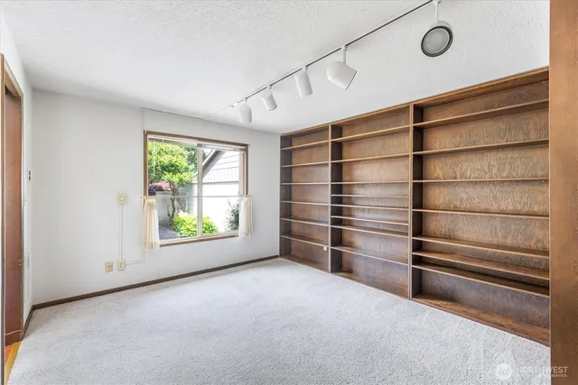 a bathroom with a sink a mirror and a shower