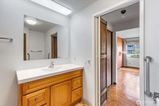 a bathroom with a sink and a mirror