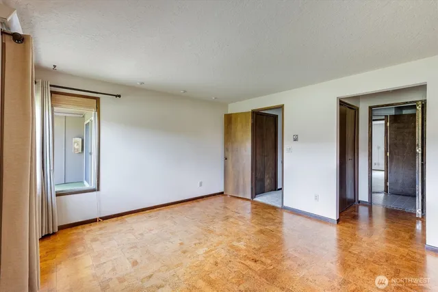 a view of a hallway with windows