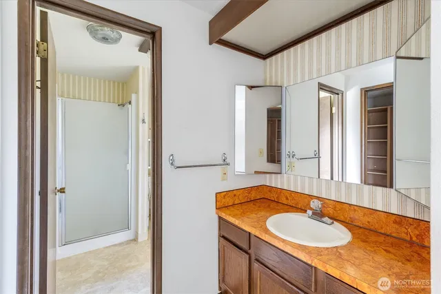 a bathroom with a bathtub and next to a window