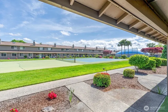 a view of a garden with houses