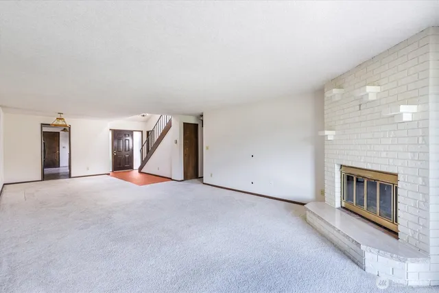 an empty room with a fireplace