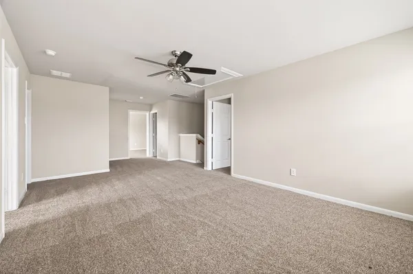 a view of a big room with carpet