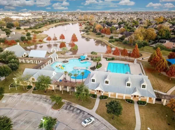 an aerial view of a house with a swimming pool