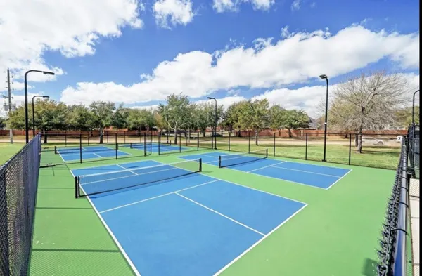 a view of an outdoor space and tennis court