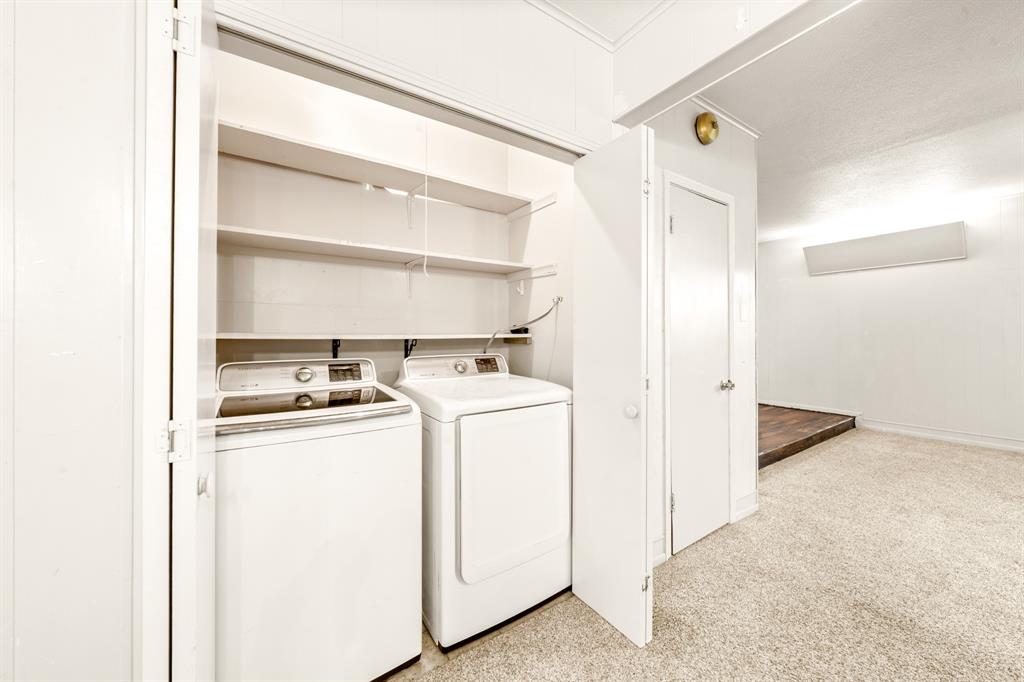 608 West Spring Street West, TX 76691 - Photo 20 of 23 Laundry area featuring built-in shelving, a washer, and a dryer