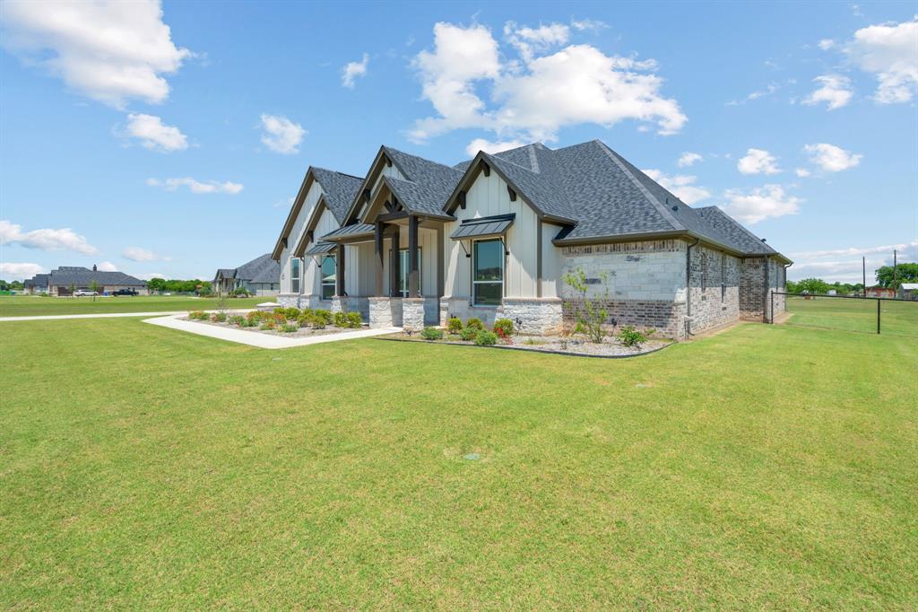 161 Frontera Drive Decatur, TX 76234 - Photo 4 of 39 Side View of Home and Spacious Frontyard