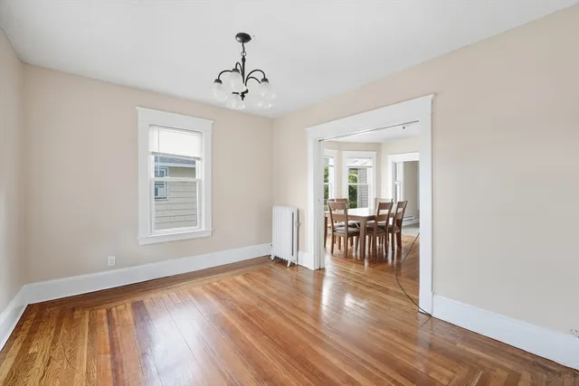 a view of a livingroom with furniture hardwood floor and a window