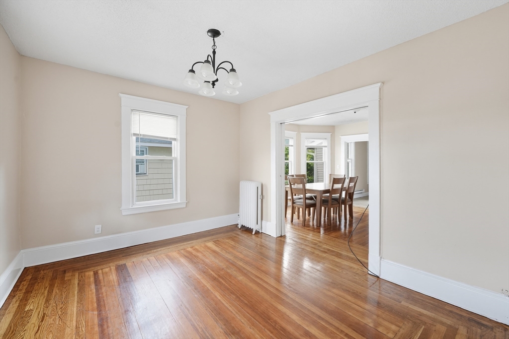 32 Santa Barbara Street, Unit 32 Springfield, MA 01104 - Photo 7 of 21 a view of a livingroom with furniture hardwood floor and a window