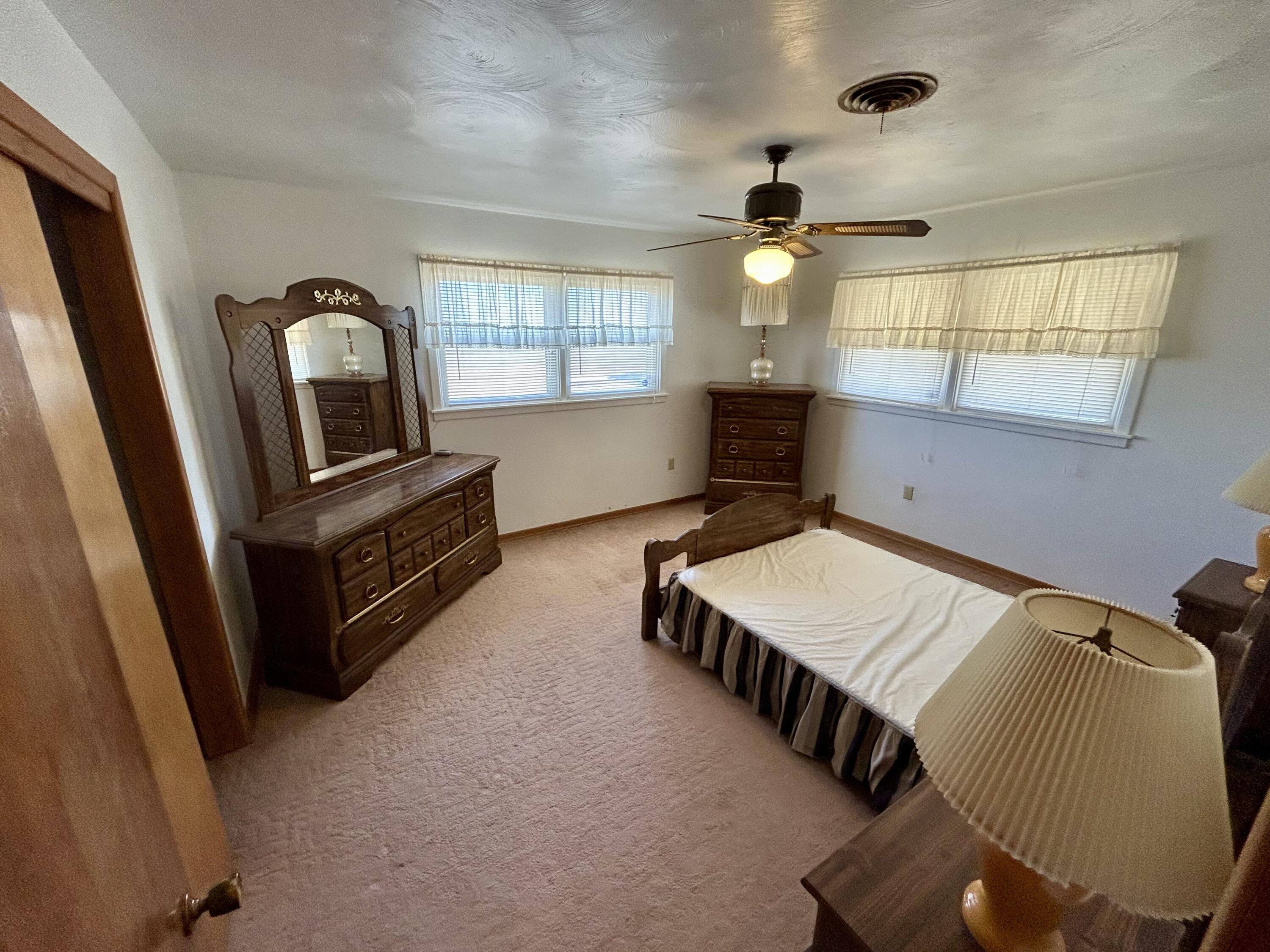 2101 Farm To Market 97 Lockney, TX 79241 - Photo 14 of 35 a room with furniture and a flat screen tv