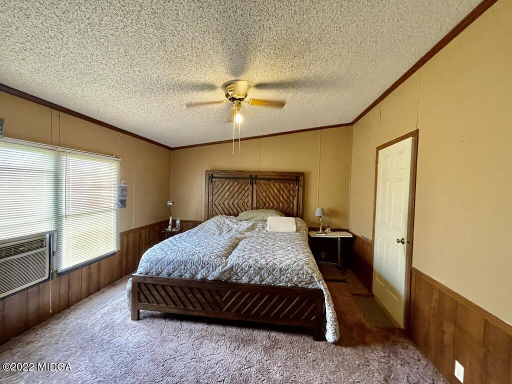 3310 Jackson Road Roberta, GA 31078 - Photo 10 of 26 a bedroom with a bed and wooden floor