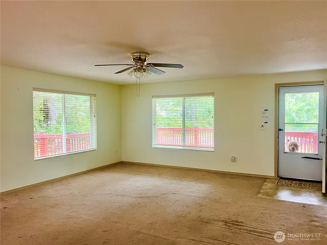 a view of an empty room with a window