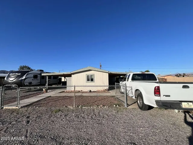 a view of a car parked in front of a house