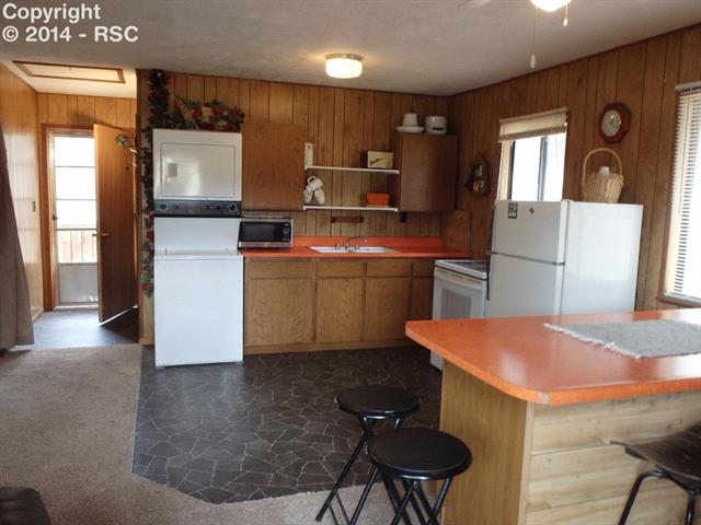340 Heiserman Road Florissant, CO 80816 - Photo 11 of 21 Easy access to back deck from living area