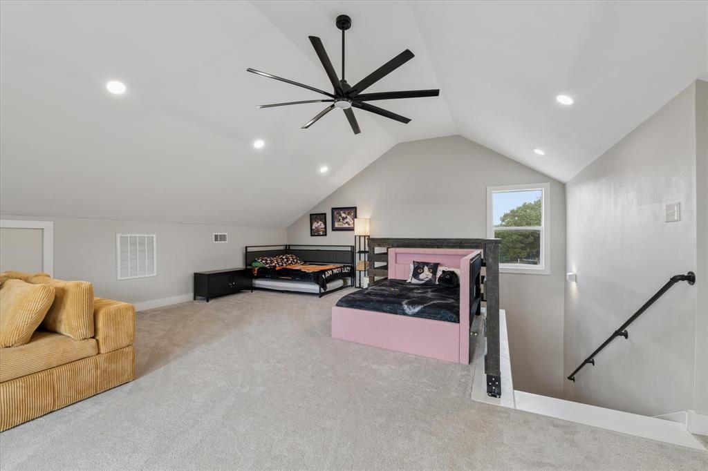 286 Benevolence Way China Spring, TX 76633 - Photo 21 of 37 Spacious second-story room featuring a vaulted ceiling with a large ceiling fan, recessed lighting, and a window providing natural light