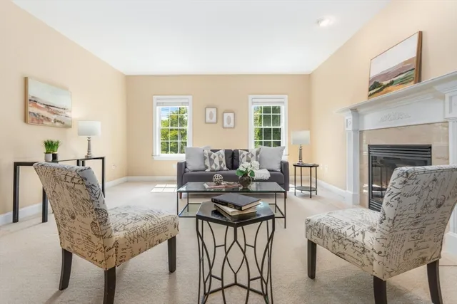 a bedroom with a bed window and a table